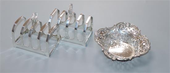 A pair of silver toastracks and a silver bonbon dish.